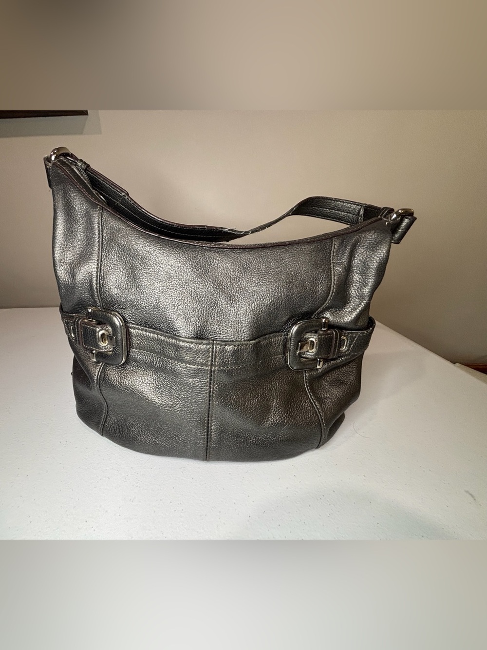 Sleek Black Leather Shoulder Bag with Buckle Accents